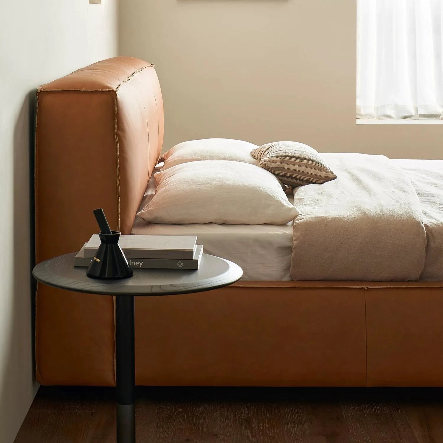 Simple bedroom renovation idea: replace old upholstery with a custom bed slipcover.