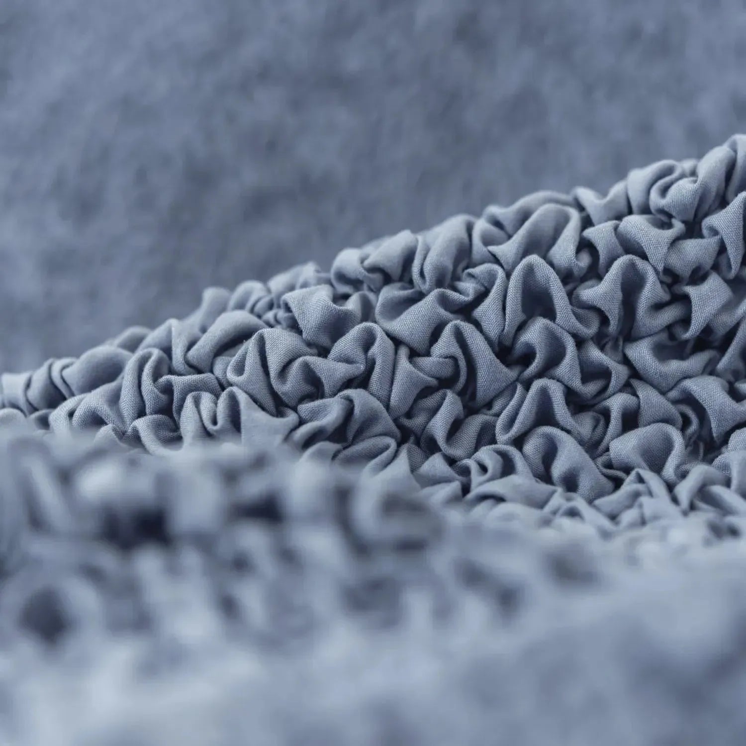 Pet-friendly blue sofa slipcover from Plume Bubble with easy-clean design