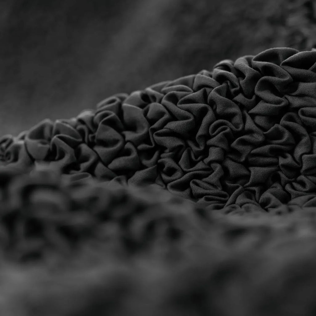 Easy-care black sofa slipcover from Plume Bubble, ideal for families and pets