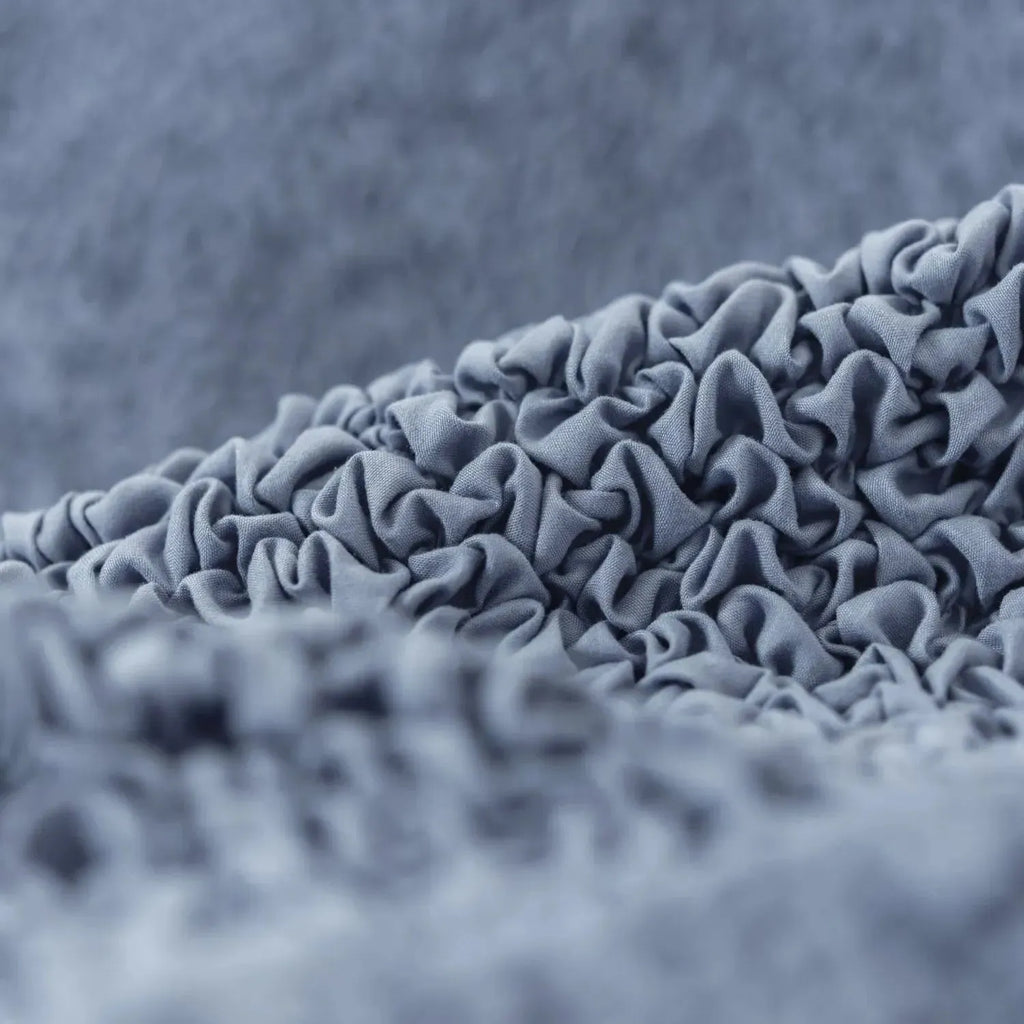 Pet-friendly blue sofa slipcover from Plume Bubble with easy-clean design