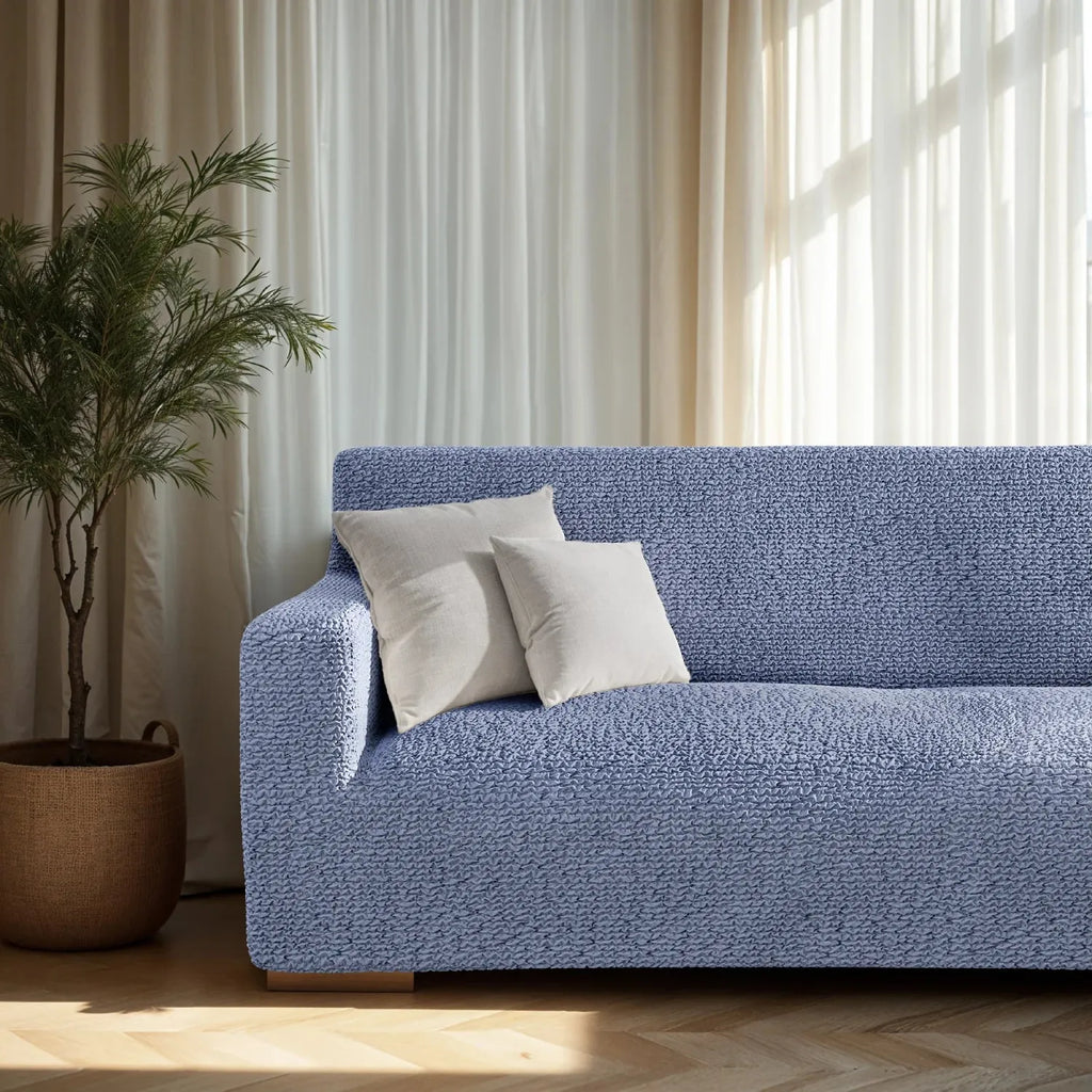 Blue sofa slipcover by Plume Bubble with a soft, modern appeal
