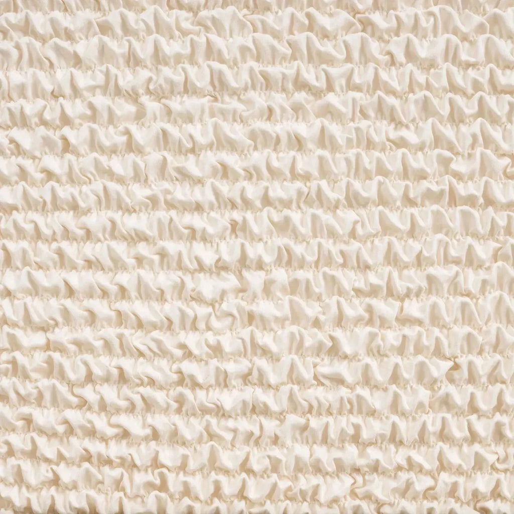 Close-up of Plume Bubble cream slipcover fabric showing delicate, soft-touch texture