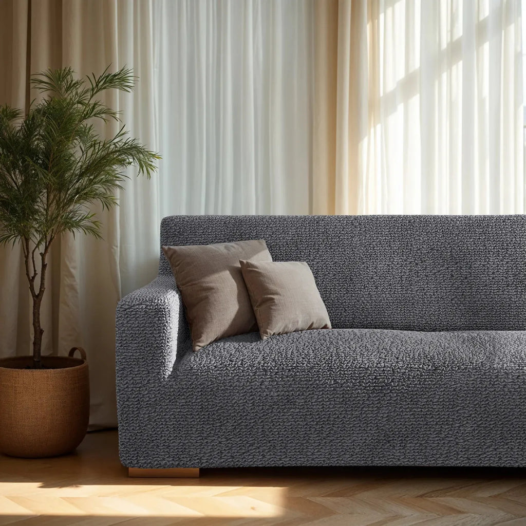 Plume Bubble gray couch cover styled in a cozy modern living room