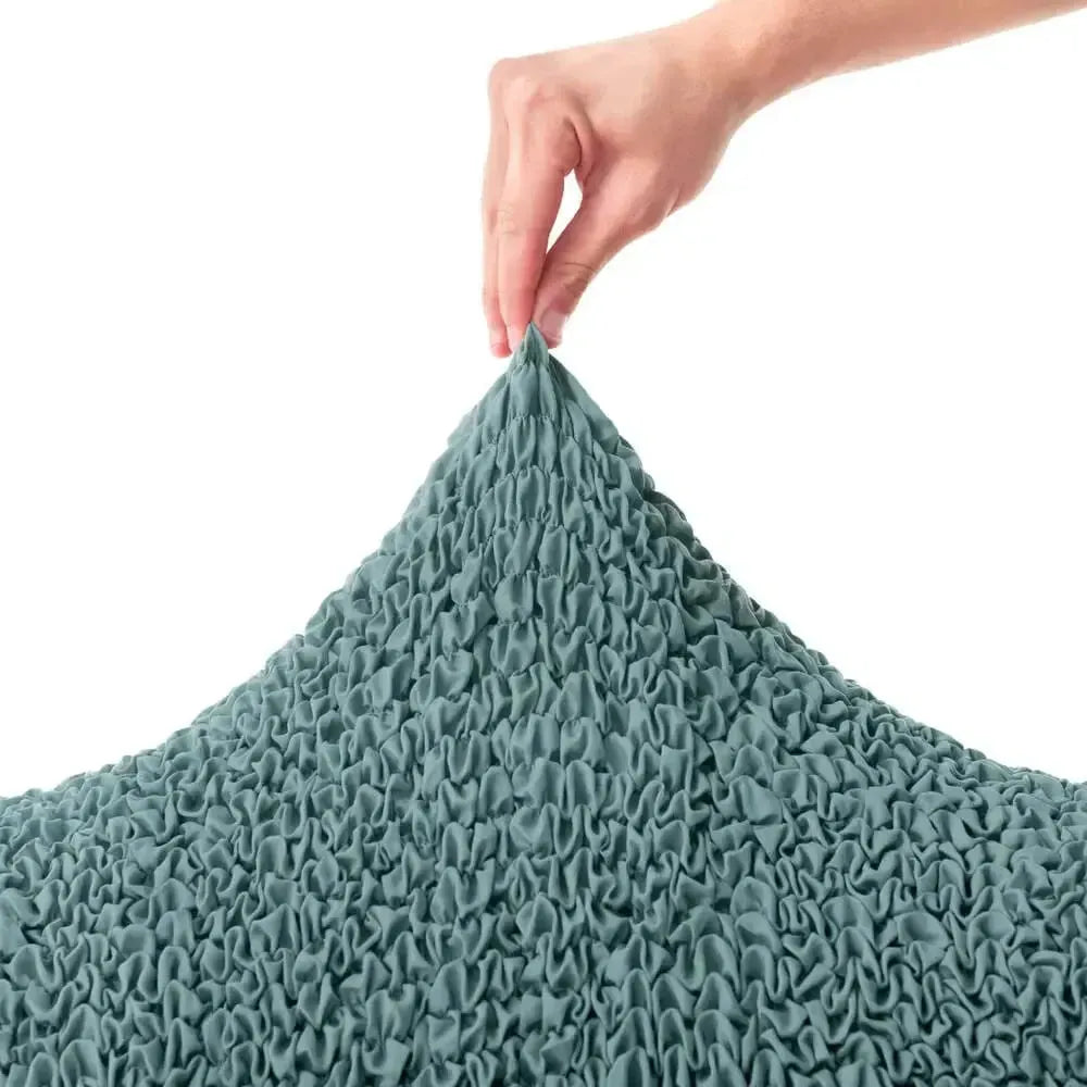 Easy-wash green sofa slipcover from Plume Bubble designed for everyday comfort