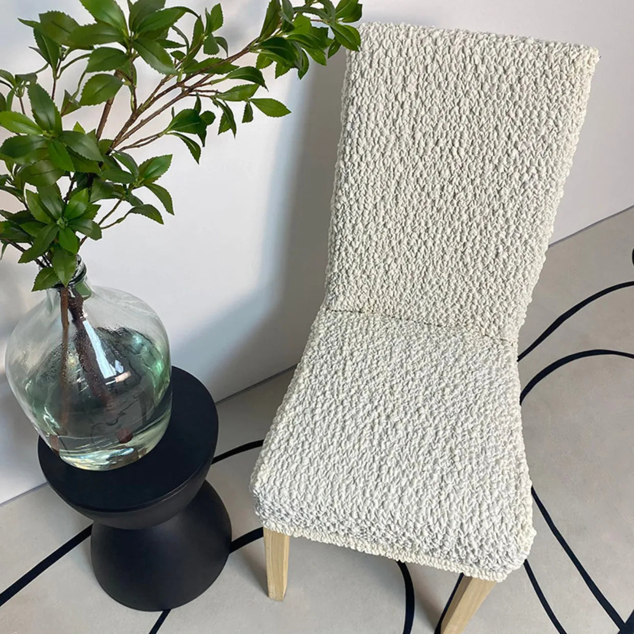 White custom dining chair cover in modern dining room – sleek, minimal, and protective slipcover for everyday use.